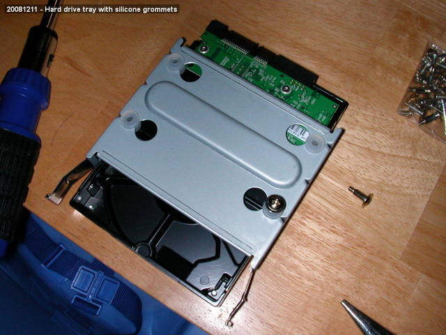 Hard drive tray with silicone grommets
